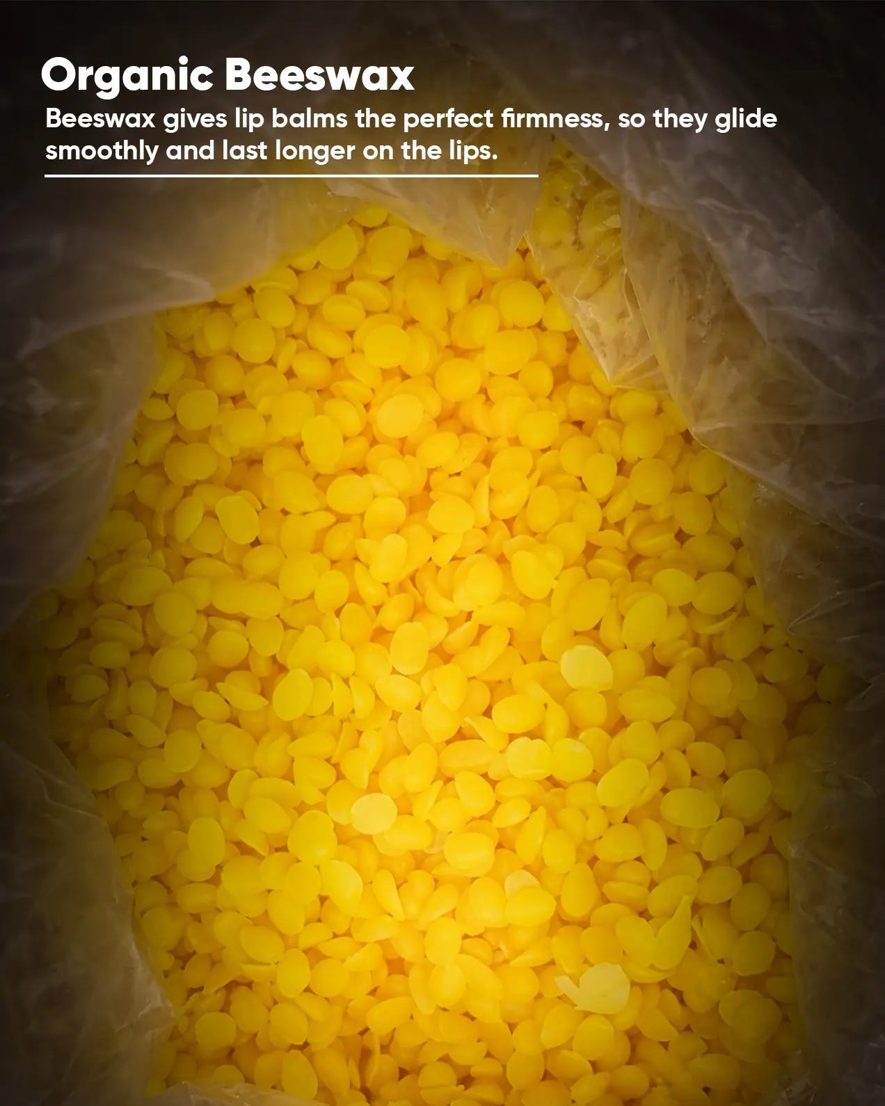 Close-up of yellow beeswax pellets with text about its benefits for lip balm.