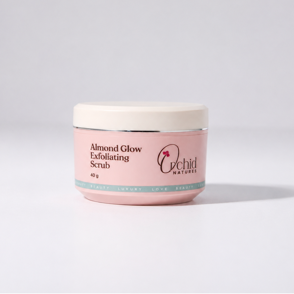 Pink jar of Almond Glow Exfoliating Scrub with Orchid Nature's logo on a light gray background