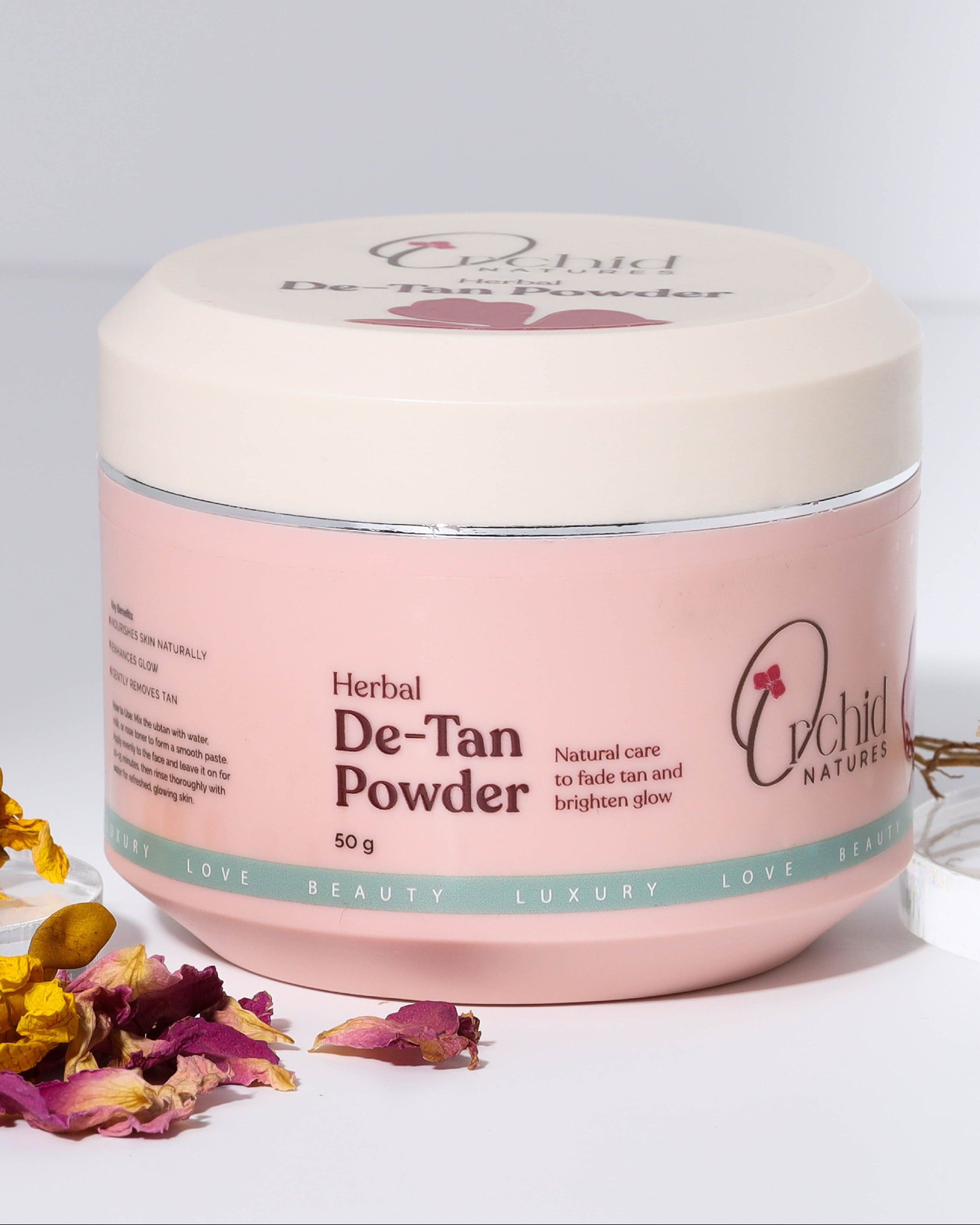 Jar of Herbal De-Tan Powder with a pink label on a light gray background