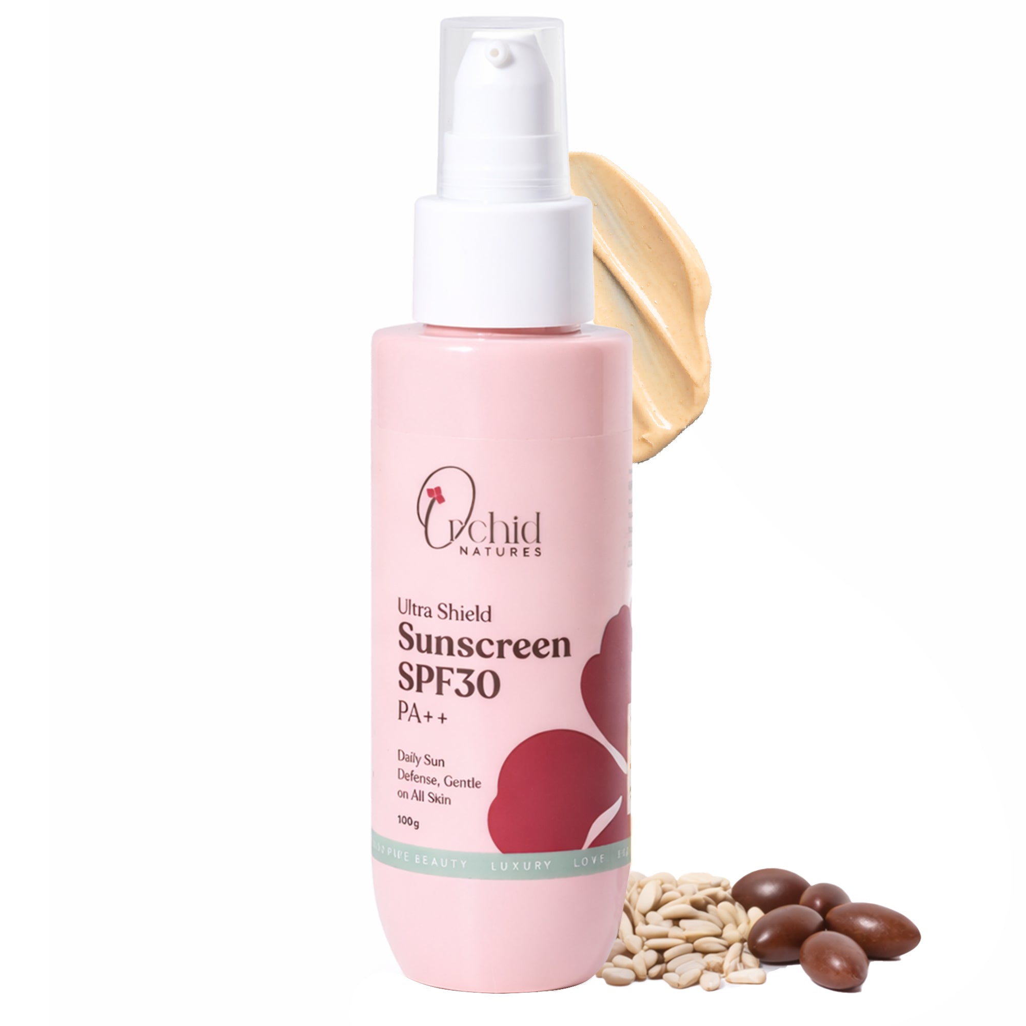 Pink sunscreen bottle with white spray nozzle on a white background